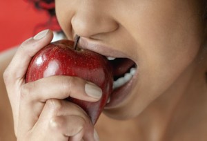 getty_rf_photo_of_woman_biting_apple